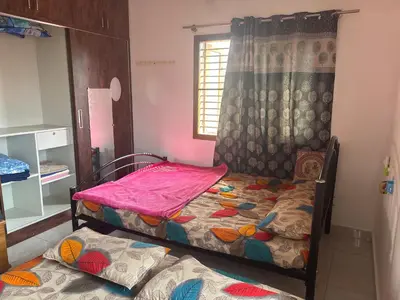 a bedroom with two bunk beds and a window at 4 Beds 6 People stay Calm, Comfortable Place in Mysore