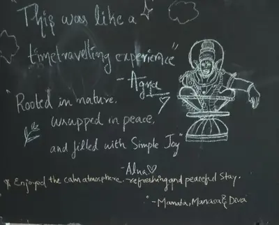 a chalk board with a drawing of a deity on it at The Cool Ranch at gaya3farms in Parli