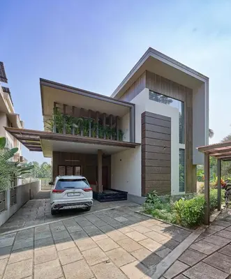 a car parked in front of a house at 4-Bedroom Villa near CIAL Airport 25 Min Drive ! in Alwaye
