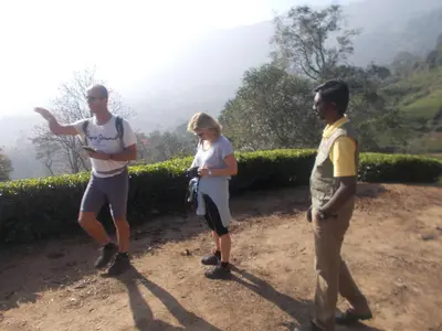 a group of people standing on a dirt road at Oak and Sky Adventures, Kanthalloor in Kanthalloor