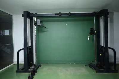 a green garage door in a room at Valparai home villas in Vālpārai
