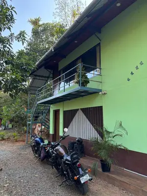 a group of motorcycles parked in front of a building at Heritage tharavadu in Mananthavady