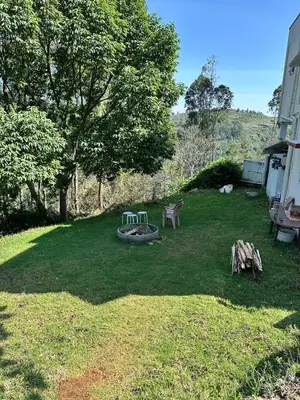 a yard with a picnic table and a bench at The Misty Woods in Kotagiri