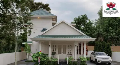 a white house with a car parked in front of it at Bougainvilla Luxury Individual Villa Kozhikode in Kunnamangalam