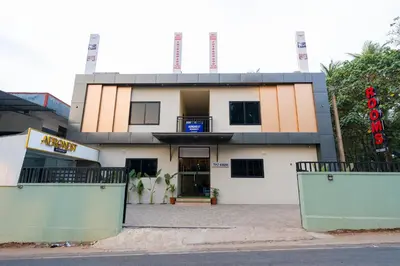a building with a sign on the front of it at Hotel Aeronest Residency in Calicut
