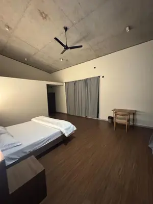 a bedroom with a bed and a ceiling at A private room in a luxury villa- The Water's Edge in Kotagiri