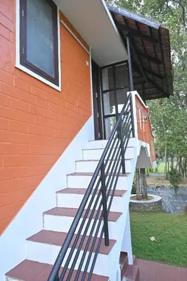 a set of stairs leading up to a house at Nisarga Greens in Chittūr