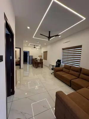 a living room with a couch and a table at Serene riverside retreat in Kozhikode