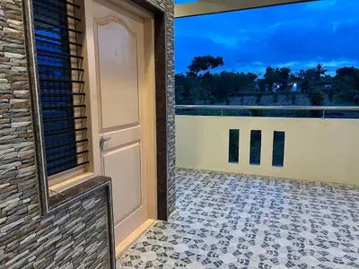 an open door to a balcony with a view at Rivora Retreat in Nanjangūd