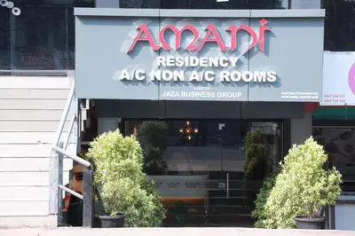a sign for anant restaurant in front of a store at Amani Residency Kannur in Kannur
