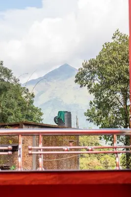 a view of a mountain from a balcony at Wayanad home stay in Vythiri