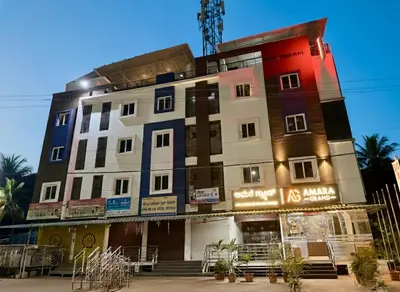 a tall building with a lot of windows at Amara Grand in Mysore
