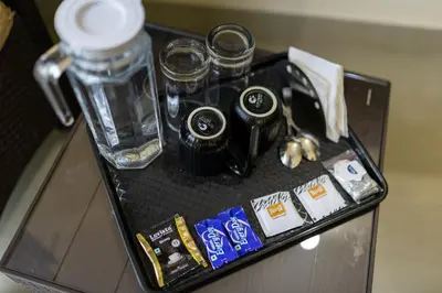 a tray with some items on a table at Bougain Villa in Madikeri