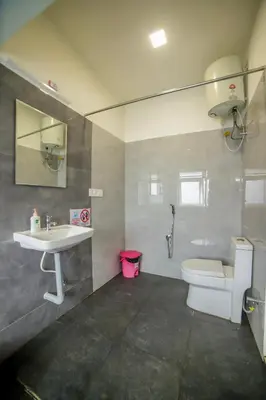 a bathroom with a sink and a toilet at Silver Heaven, Kotagiri in Kotagiri