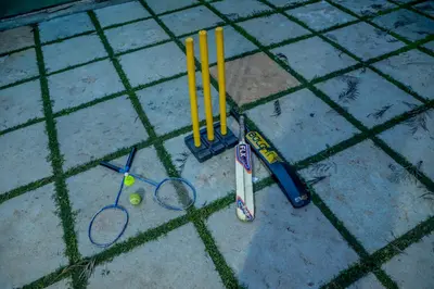 a group of tennis rackets and balls on the ground at Silver Heaven, Kotagiri in Kotagiri