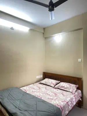 a bedroom with a bed and a ceiling at Le Divine C3 Premium 1bhk Apartment 100meters from Guruwayur temple in Guruvāyūr