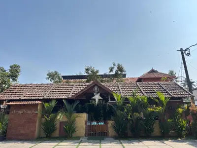 a building with a cross on top of it at Ponyo Stays in Cochin