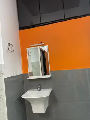 a bathroom with a sink and a mirror at Mount holidays in Meppādi