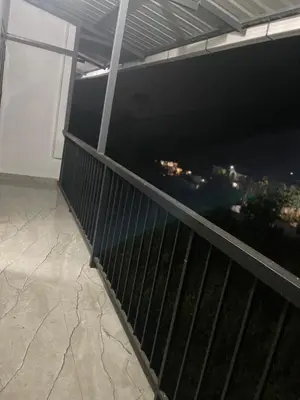a balcony with a view of a city at Mount holidays in Meppādi
