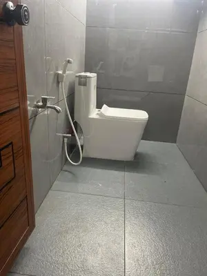 a bathroom with a toilet in a shower stall at Mount holidays in Meppādi
