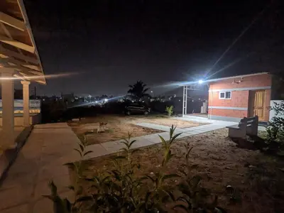 a night view of a building with lights on it at JRD House in Mysore
