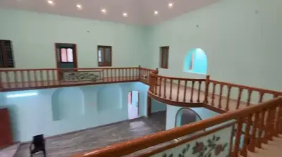 a large room with a swimming pool in a building at Sindhu Residency in Coimbatore