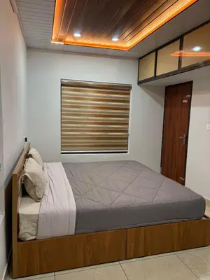 a bedroom with a bed and a window at ARAMAM SERVICE VIlla in Mananthavady