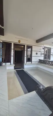 a large room with a swimming pool in a building at Mocha Valley Homestay in Kalpetta