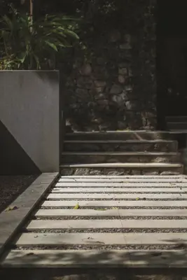 a set of stairs in front of a building at Rainforest Resort in Athirappilly