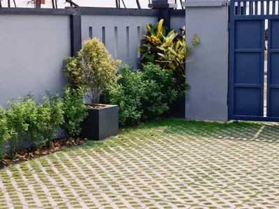 a house with a blue door and some plants at Ambadis Beach View 3BHK Pool Villa in Pallipuram