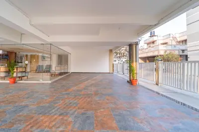 an empty hallway of an office building with a balcony at Treebo Premium Cachet Suites in Coimbatore