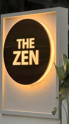 a sign that says the zen on a wall at The Zen Retreat in Kozhikode