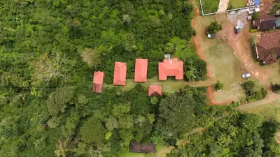 an overhead view of a house with red structures at Coffee County in Srimangala