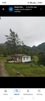 a screenshot of a picture of a house with a tree at Haven heights kanthalloor in Kanthalloor