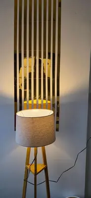 a wooden chair with a lamp in a room at SARA'S LUXURY stay in Coimbatore (Peelamedu)