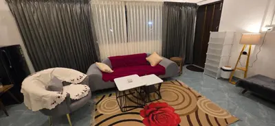 a living room with a couch and a table at SARA'S LUXURY stay in Coimbatore (Peelamedu)