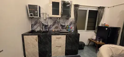 a kitchen with a sink and a counter top at SARA'S LUXURY stay in Coimbatore (Peelamedu)