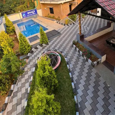 an overhead view of a garden with a swimming pool at Unnati Luxury Homestay Coorg in Madikeri