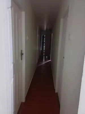 an empty hallway with a long hall way at Apple Valley in Munnar