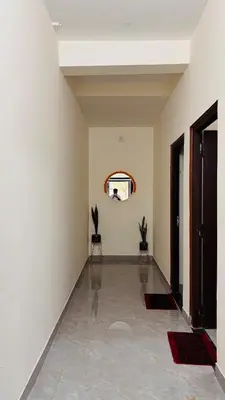 a room with a hallway with a mirror on the wall at Ashley Homestay 2BHK Codissia, Airport, Tidel Park in Coimbatore