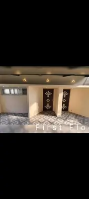 a view of a room with a first floor at R N P Guest House in Pollāchi