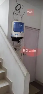 a tv hanging on the wall next to a door at K square in Coimbatore
