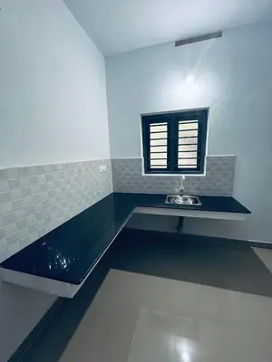 a bathroom with a sink and a window at VYSHNAVI 2BHK AC Apartment in Thanniyam