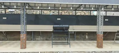 a chair sitting on a platform in a train station at Matha homestay Vattavada in Vattavada