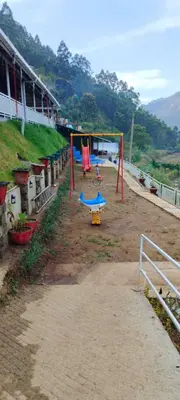a group of playground equipment in a dirt field at Matha homestay Vattavada in Vattavada