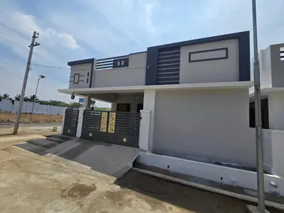a building with an open door on the side of it at Eachanari Karpaga Rathinam Residency By Shivalaya Stays in Coimbatore