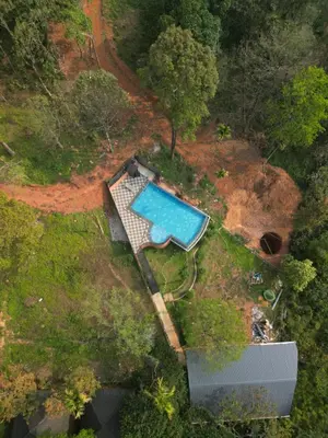 an overhead view of a swimming pool in a yard at Kashmeeram Resort in Vayittiri