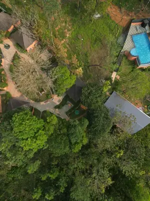 an overhead view of a house and a swimming pool at Kashmeeram Resort in Vayittiri