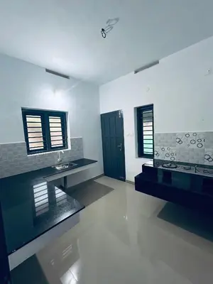 a large bathroom with a sink and a mirror at Vyshnavi 2 BHK AC Apartment in Thanniyam
