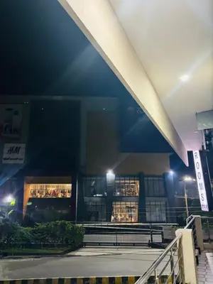 a building with lights in front of it at night at Forum Stay in Mysore